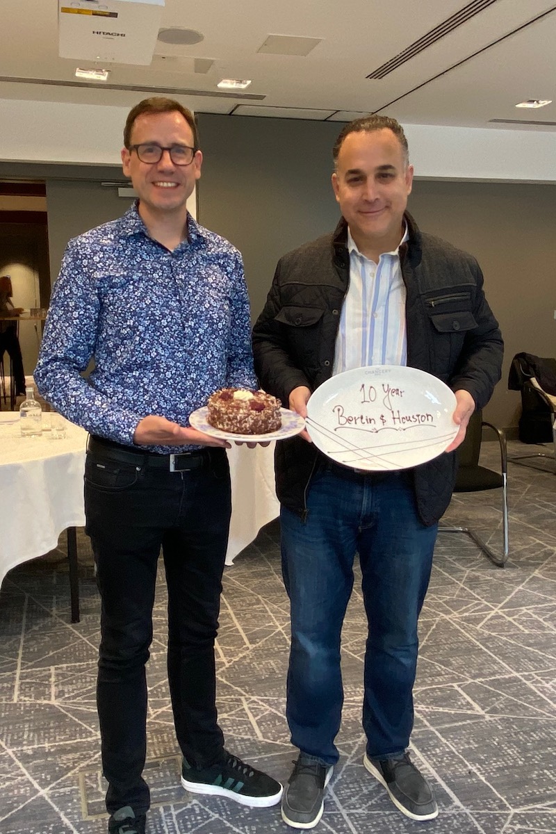 Marco from Berlin and Daniel from Houston with an anniversary cake to celebrate the 10th anniversary of their city in the alliance