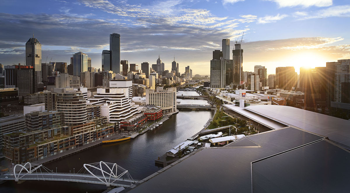 Aerial photograph of the MCEC Melbourne Convention and Exhibition Centre against a sunrise