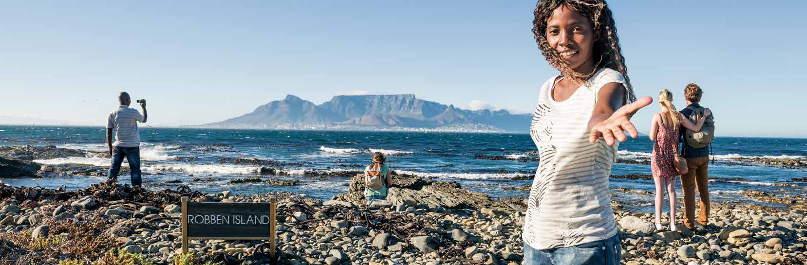 people taking picture of Robben Island